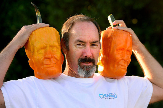 Tony Dighera holds a couple of his Frankenstein pumpkins he grows at his farm, Cinagro Farms in Fillmore. Friday, Sept. 26, 2014. His Frankenstein pumpkins are for sale at Whole Foods and Gelsons. (AP Photo:Los Angeles Daily News, Michael Owen Baker)
