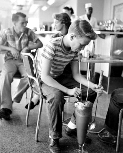 Teenager Drinking Large Milkshake Lincoln Nebraska 1953 by Genevieve Naylor
