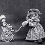 Cat pushing a pram