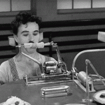 Charlie Chaplin eating corn on the cob