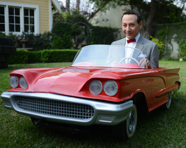 Pee-wee Herman in a little red car