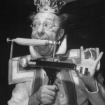 comedian-ed-wynn-clowning-as-the-king-bubbles-eating-corn-on-the-cob-with-a-typewriter-mechanism